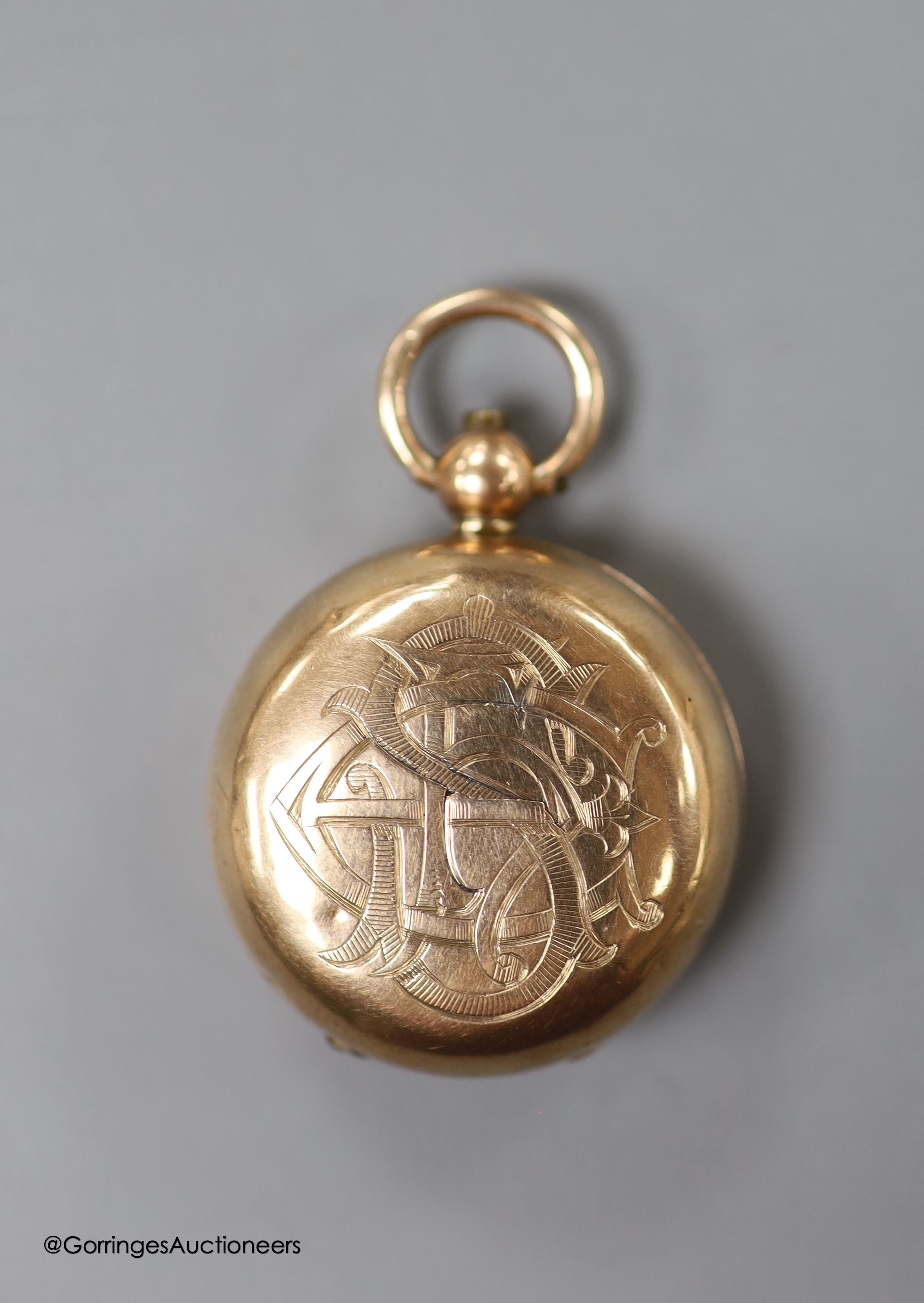 A 9ct gold sovereign case, with engraved monogram, 30mm, gross weight 15.6 grams, containing a George V 1911 gold sovereign